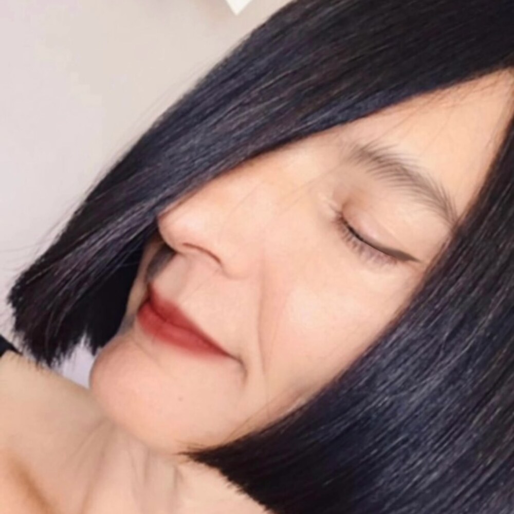 Glossy, sleek black bob haircut by Behnaz Azargam at Salon Bravissimo