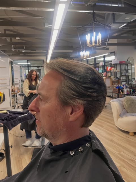 Long layered dark brown hair by Jose Antonio at Salon Bravissimo