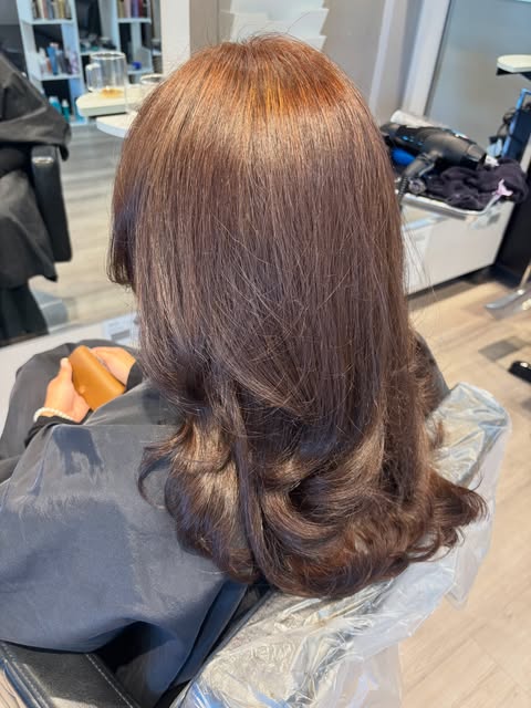 Rich brown layered hair with curled ends by Kyla Mamangon at Salon Bravissimo