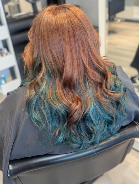 Long, soft blonde waves from behind, styled by Layla Dickson at Salon Bravissimo