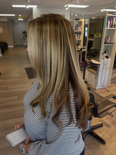 Long layered hair with golden highlights