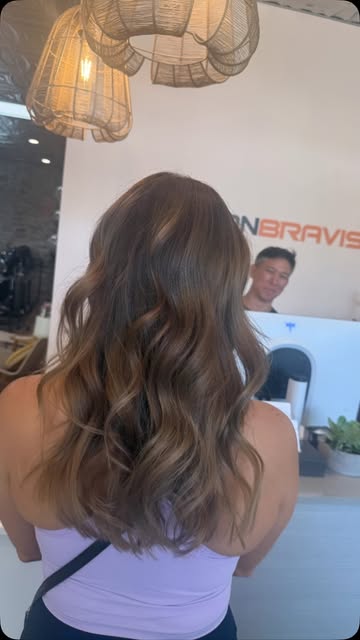 Long wavy brown hair with soft caramel dimension
