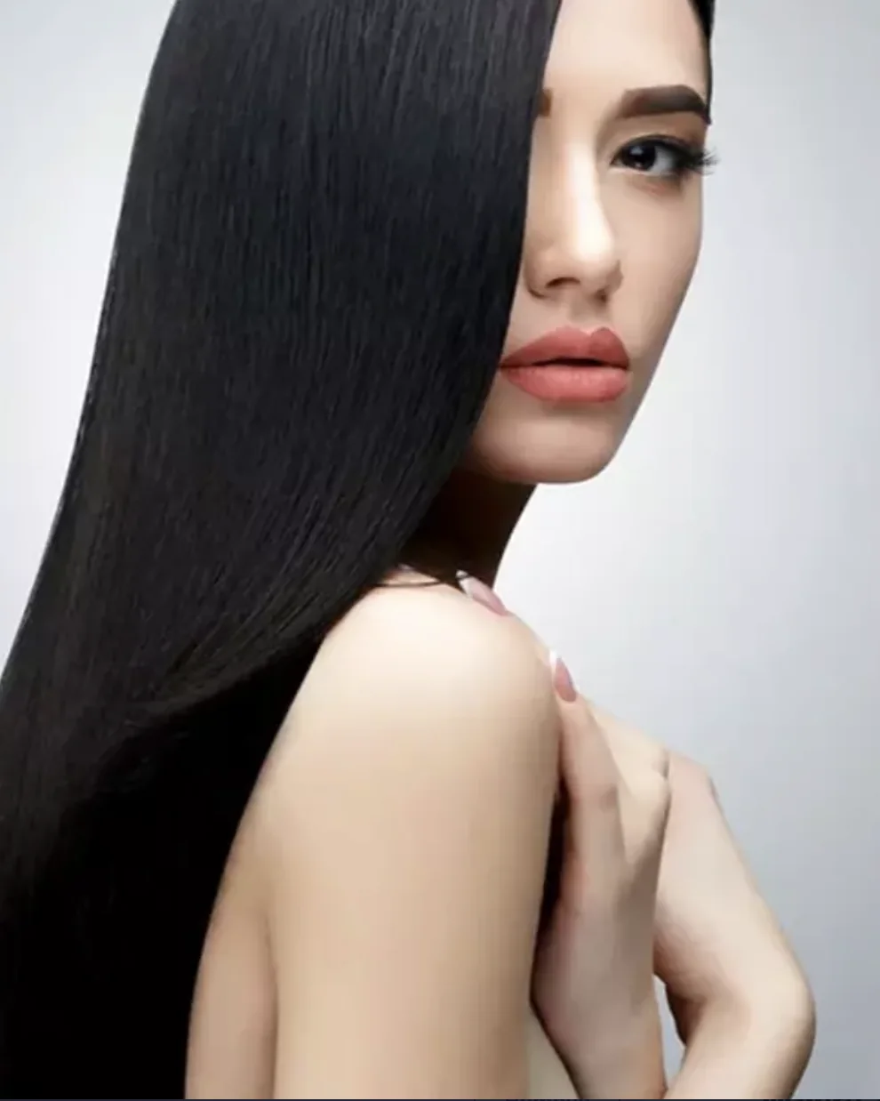 Model with very long, straight, glossy black hair after Yuko Japanese straightening