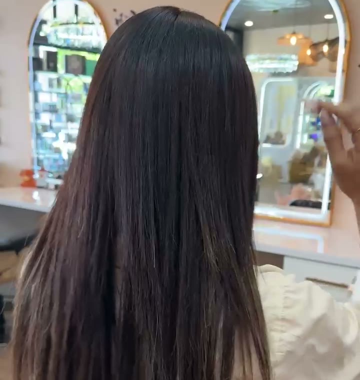 Long, smooth, shiny dark hair after SB Custom Smooth, seen from behind